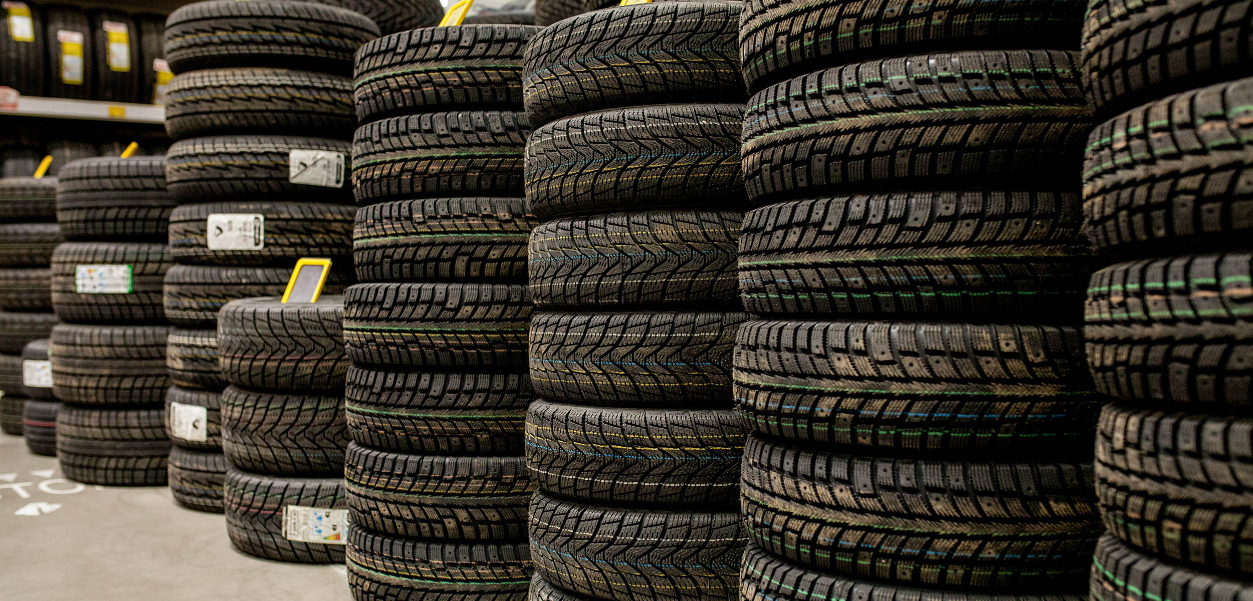 New tires stacked up in a warehouse