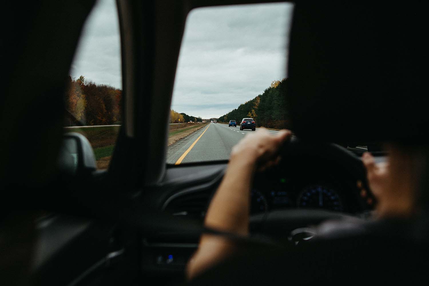 person driving in left lane of two lane highway