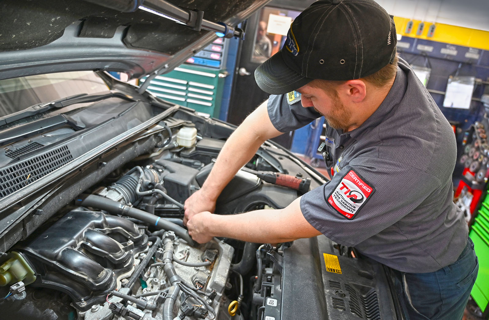 A new windshield while being installed on a vehicle