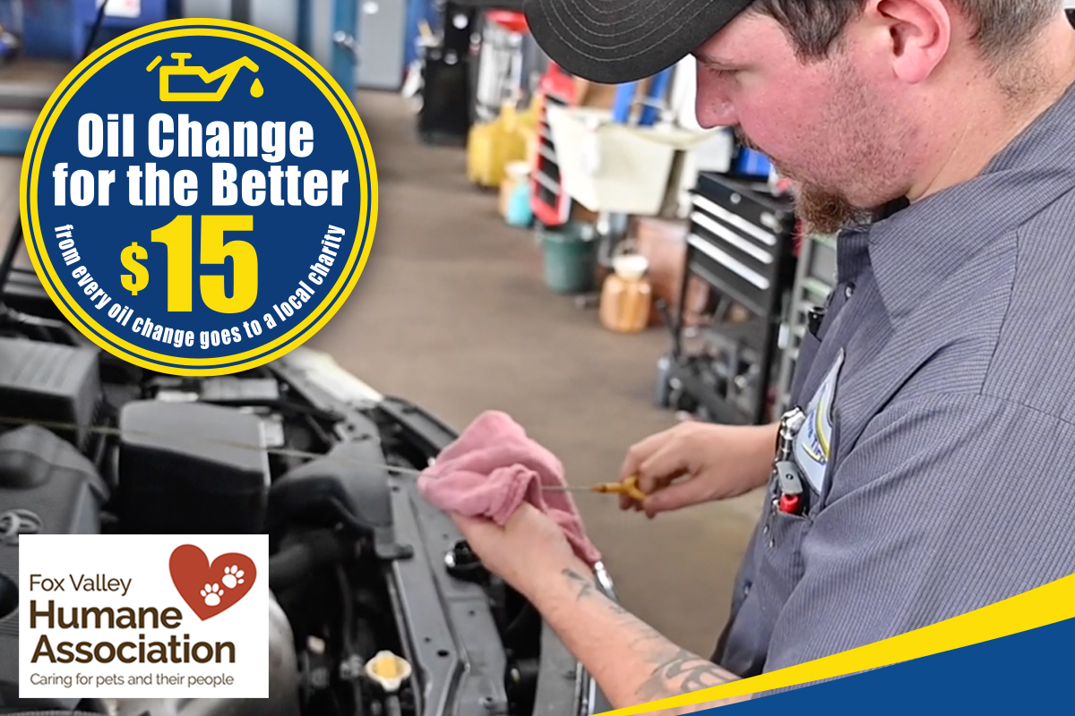 Matthews Tire technician changing oil on vehicle