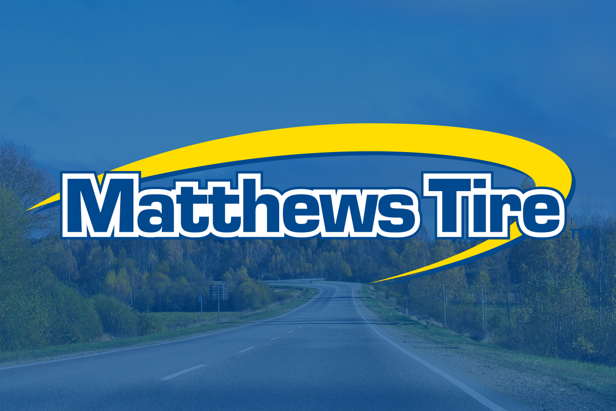 Matthews Tire logo overlaying a back country road