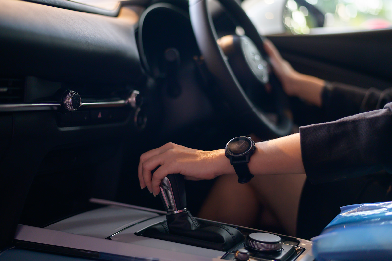 Driver shifting automatic transmission gear in a vehicle during diagnostics in Appleton, WI.