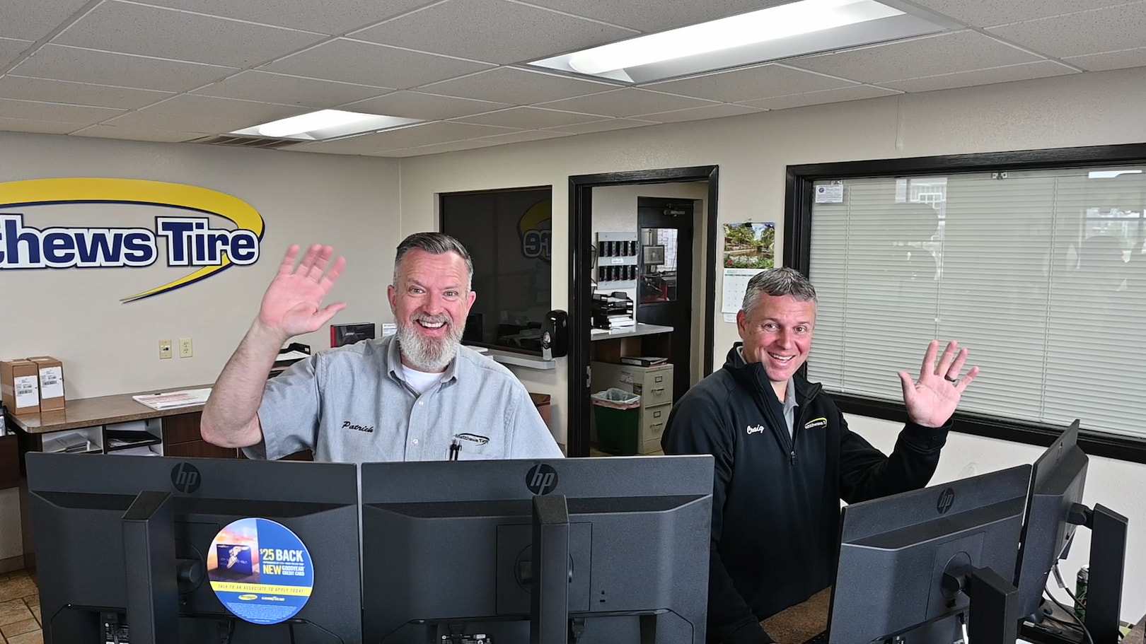 Matthews Tire customer service team greeting guests at front counter in Green Bay, WI.