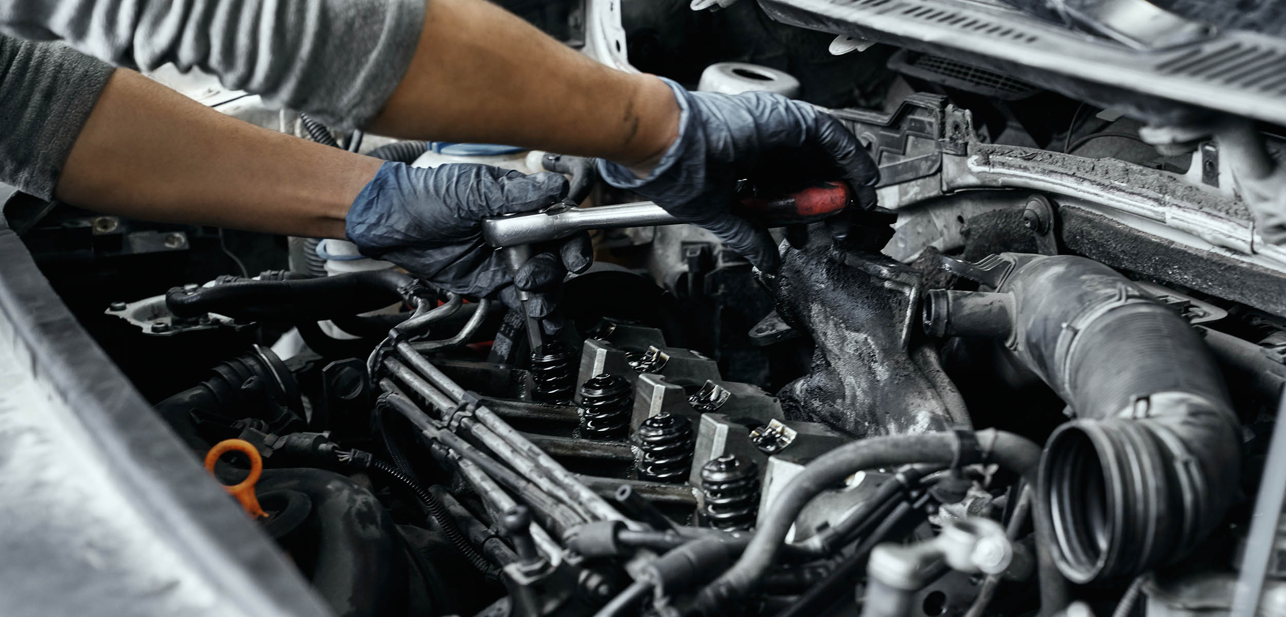Oil being poured into engine during an oil change service