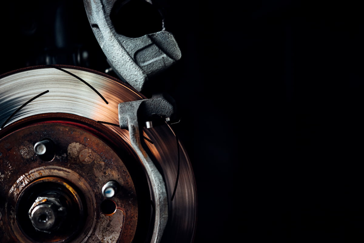 new brake pads being installed on vehicle