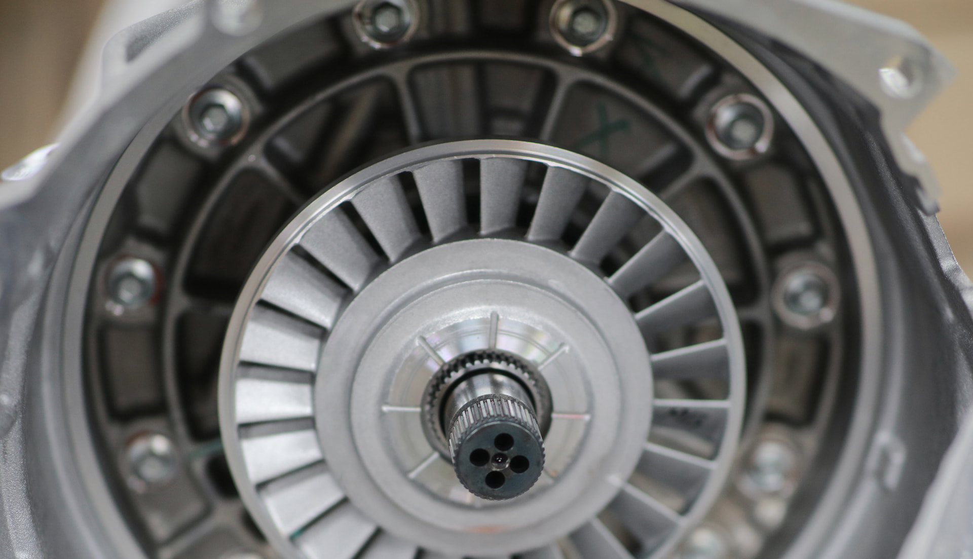 Detailed view of a torque converter component during transmission repair in Menasha, WI.
