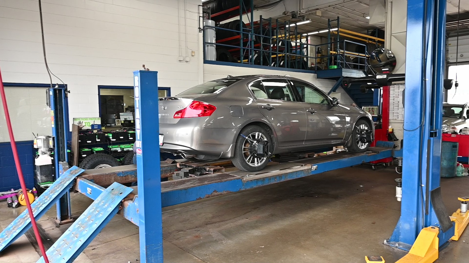 Sedan on alignment rack at Matthews Tire during wheel alignment in Menasha, WI.