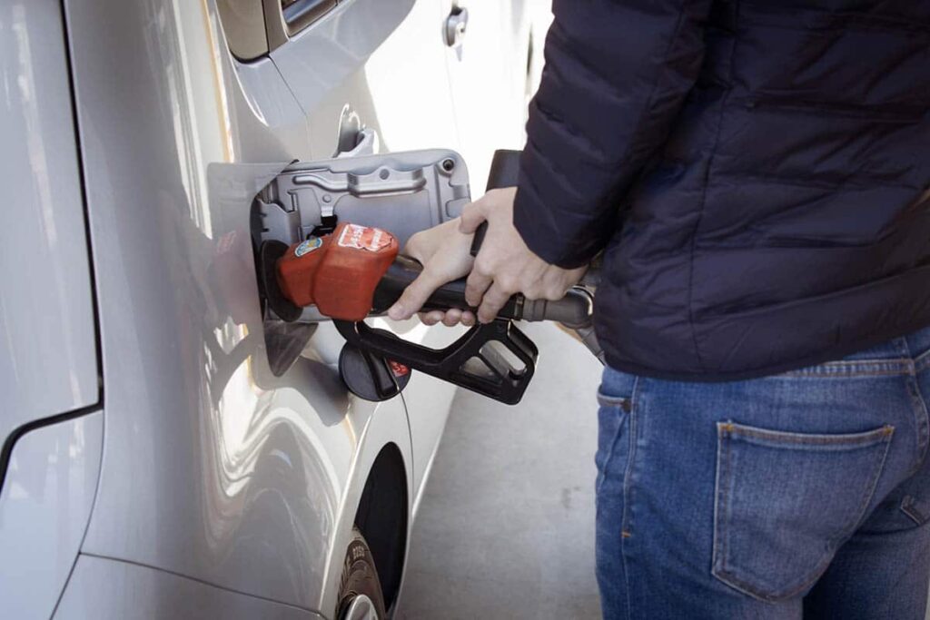 person-filling-vehicle-at-gas-pump