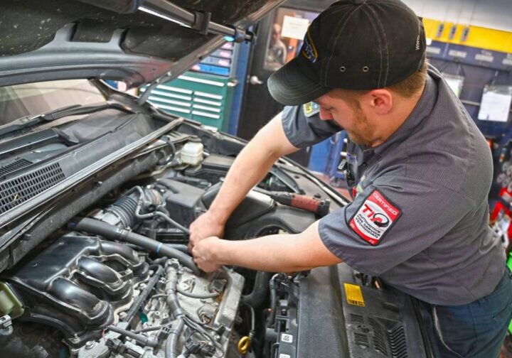 matthews-tire-automotive-technician-working-engine