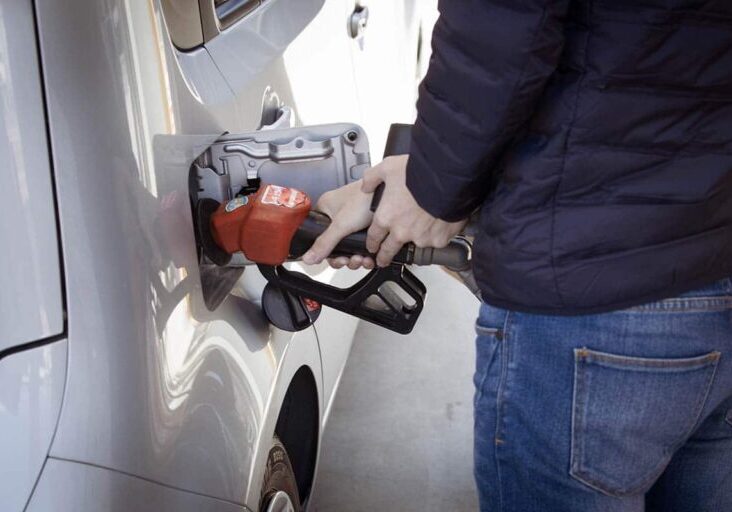 person-filling-vehicle-at-gas-pump
